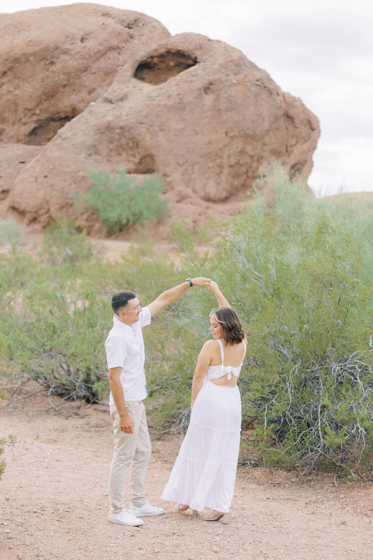 Capture the whimsy of your love with an engagement session at Papago Park in Scottsdale. This gallery features striking red rock formations, serene desert scenery, and playful moments that reflect the joy and excitement of your engagement
