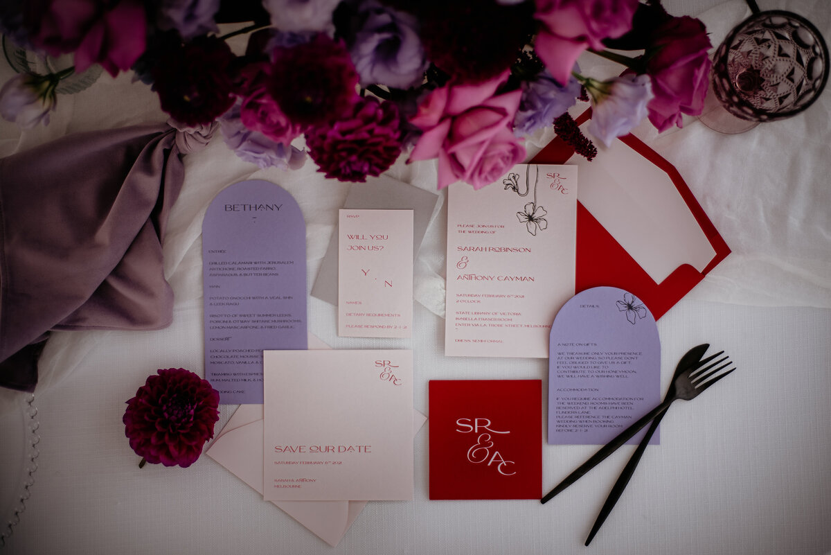 Red and lilac wedding invitaiton suite with nude invitation with flower graphic