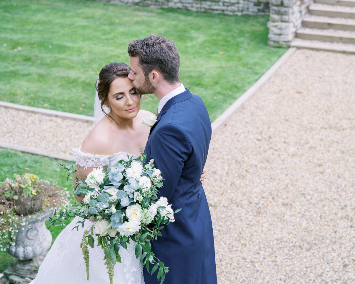 Bride and groom at modern, classic wedding at Bourton Hall