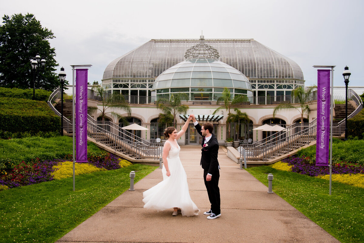 wedding picture in front of phipps conservatory