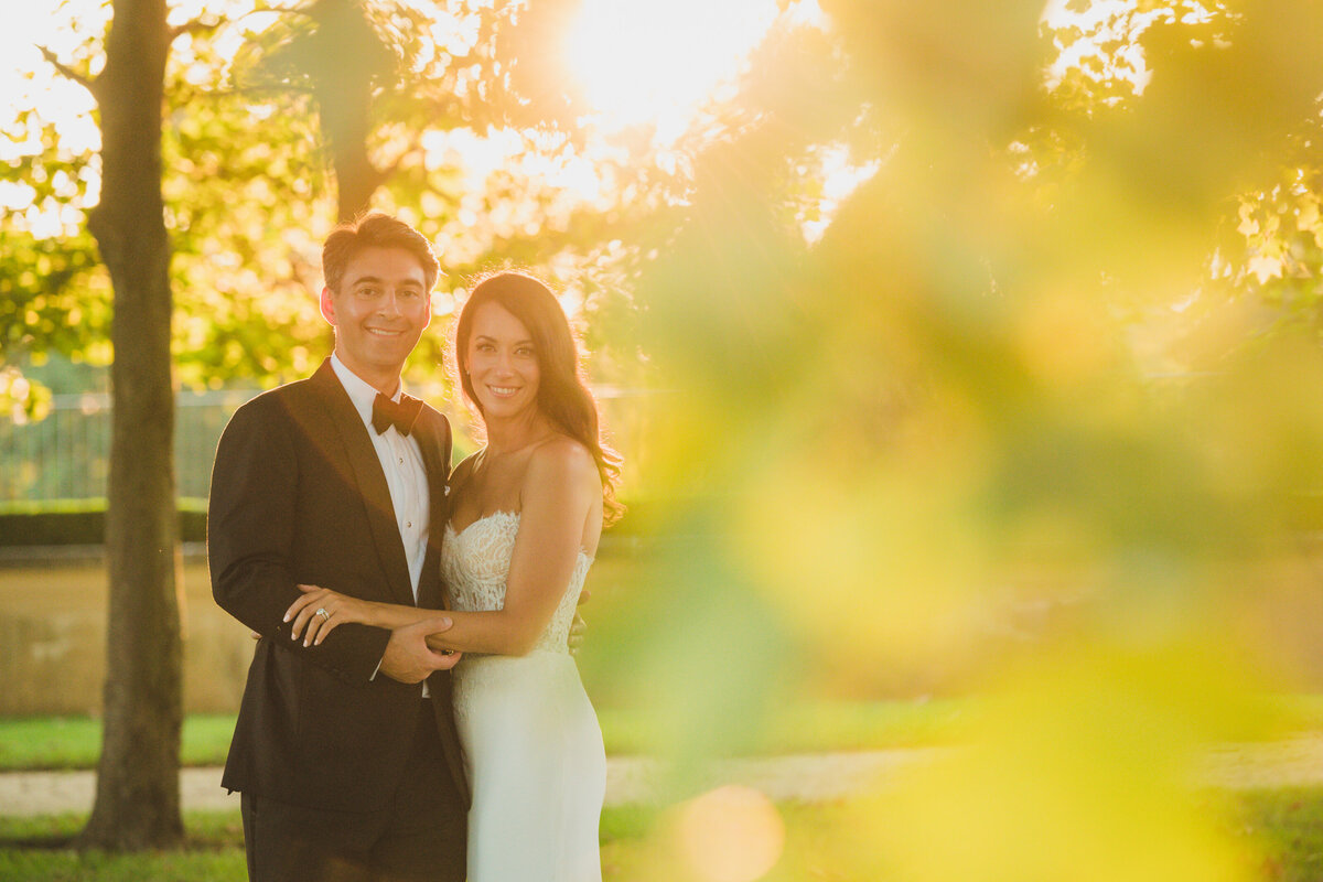 bride and groom smiling at golden hour at Oheka Castle
