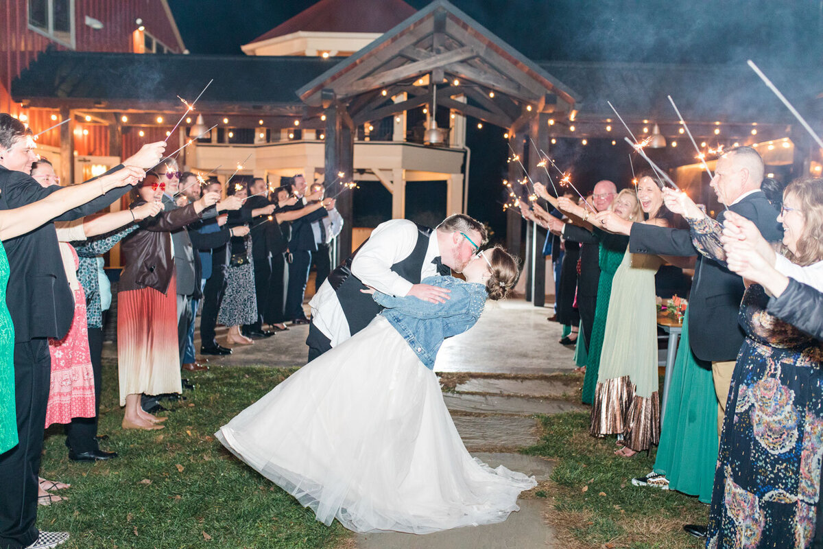 Bride and groom's deep kiss before leaving the venue