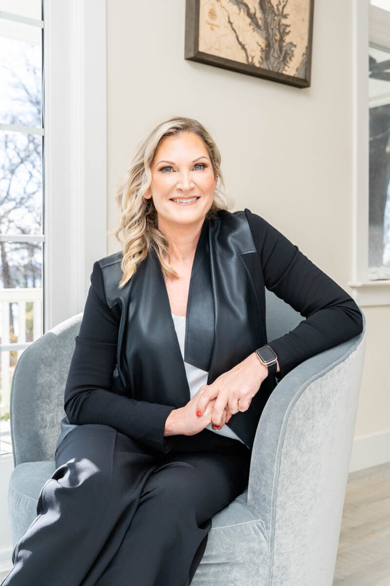portrait of a business  owner sitting in a chair for her personal branding photography