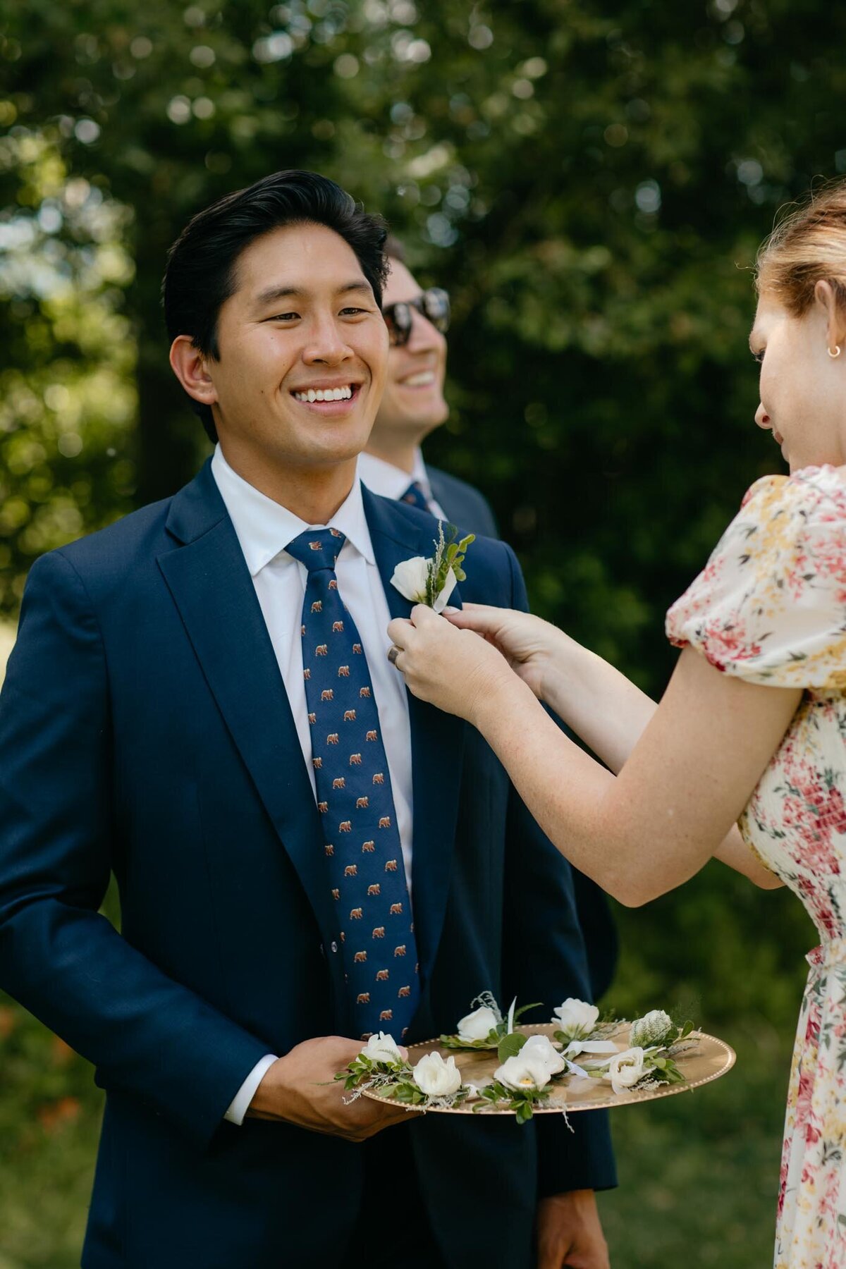 Smiling-groomsman-boutonniere-Diamond-Cross-Ranch-wedding