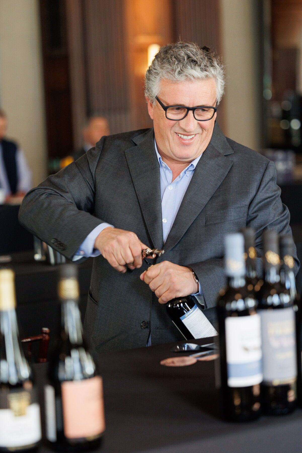 Man opening a bottle of wine