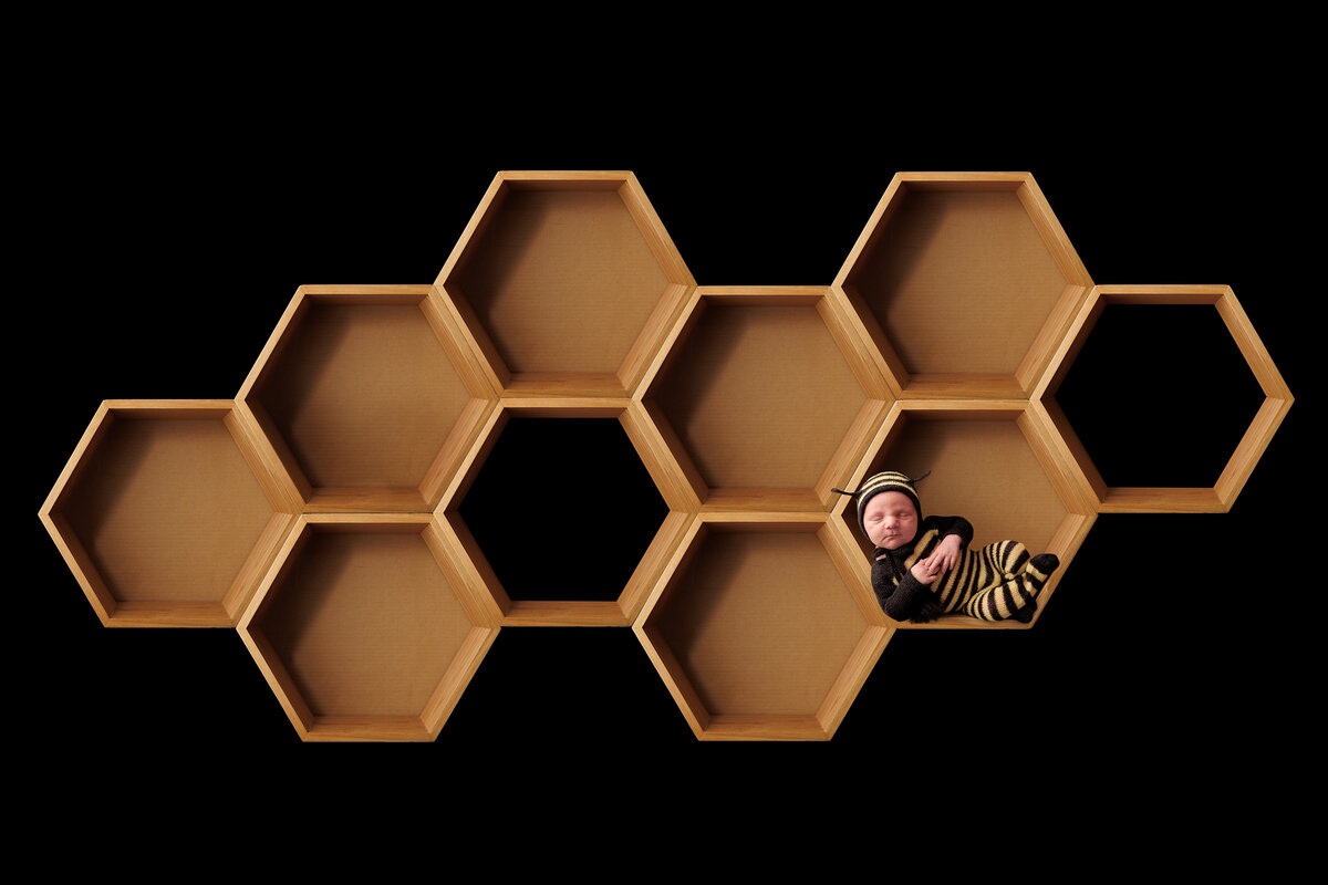 sleeping newborn baby on light grey fabric