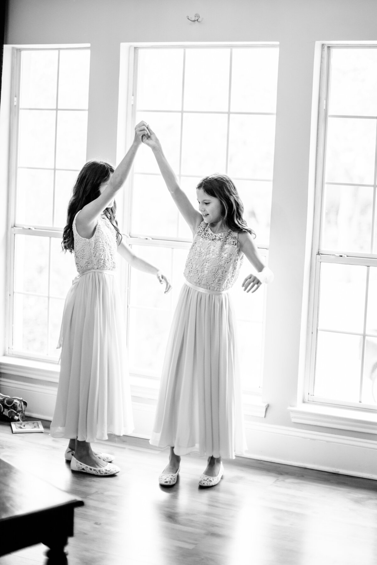 flower girls dancing at Gardens at West Green a Hill Country wedding venue by San Antonio wedding photographer Firefly Photography