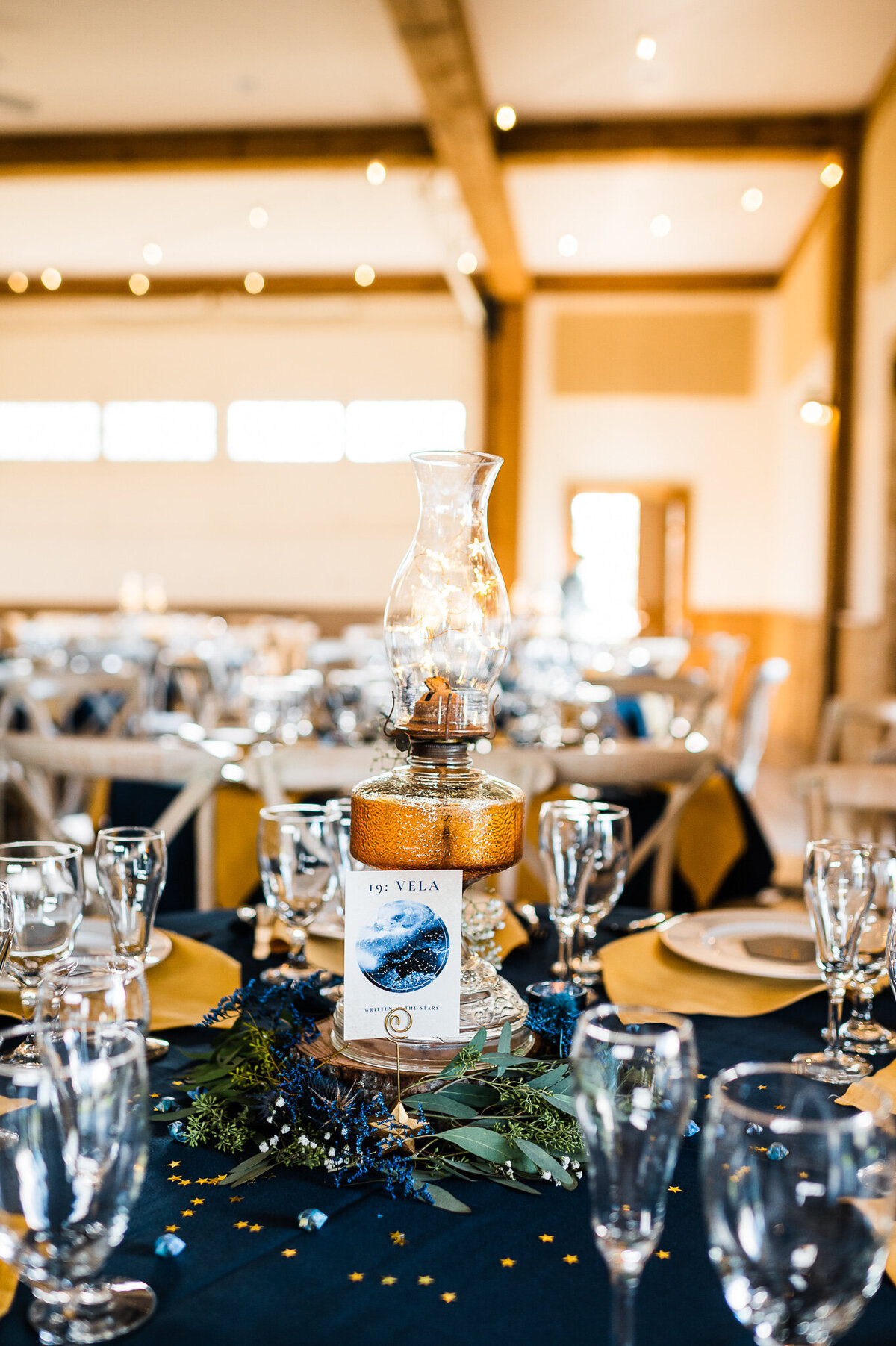 wedding reception table decor with blue and gold accents at Shenandoah wedding venue