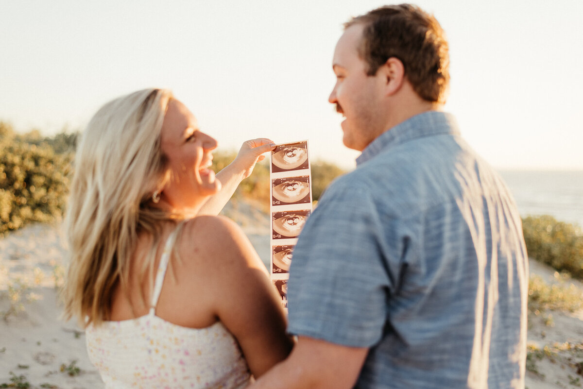Pregnancy announcement photos at Padre Balli Park