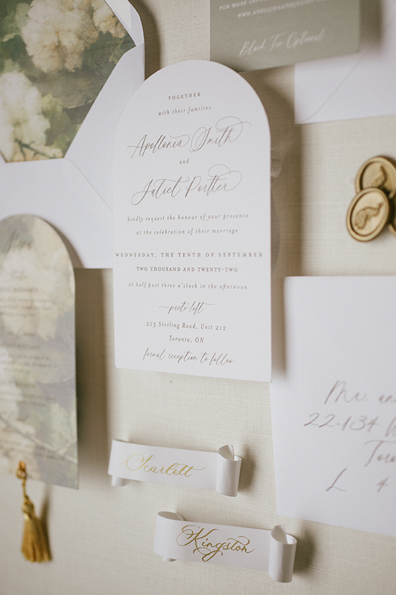 Arched wedding invitation calligraphy details and custom wax seal