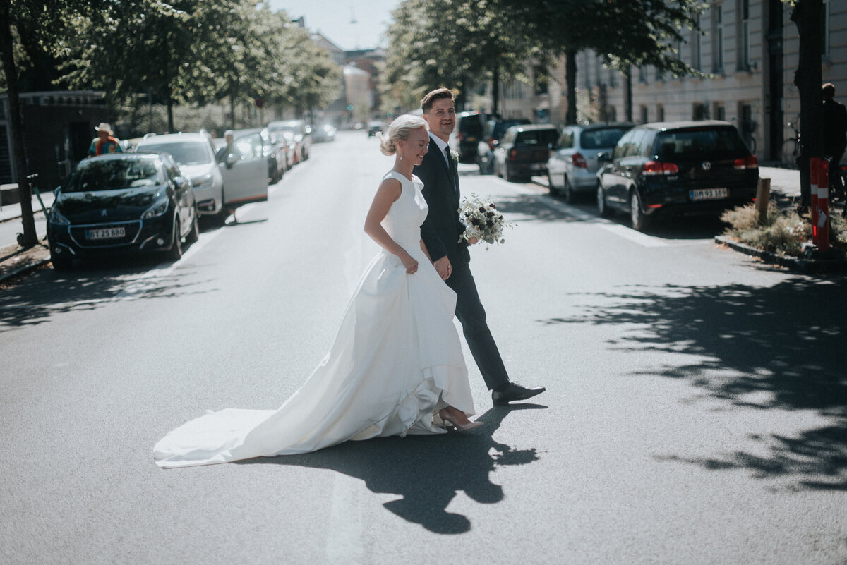 bride and groom crossing street