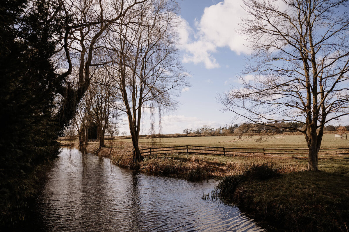 caswell-house-autumn-pond-blue-skies