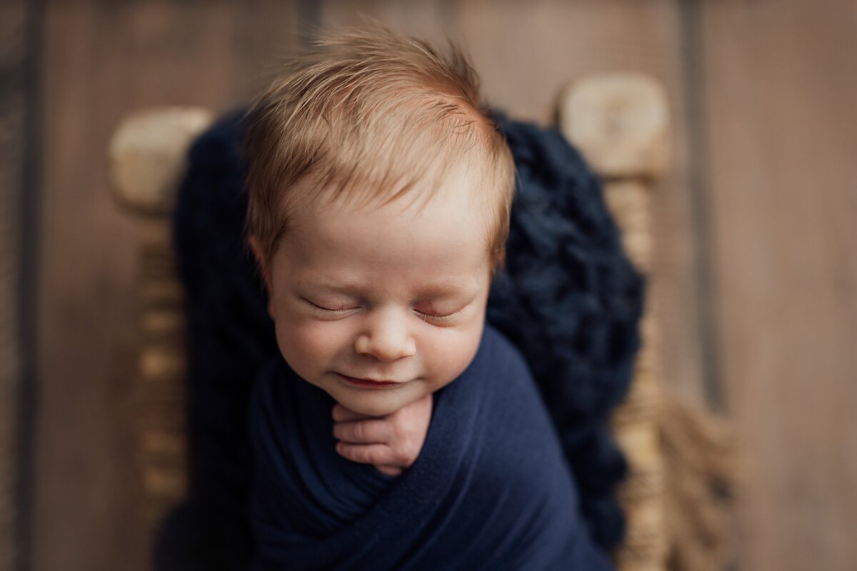 newborn smiles during photoshoot in tampa