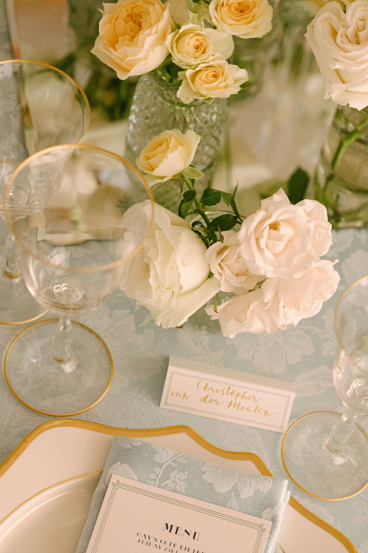 pale blue tablecloth and flowers