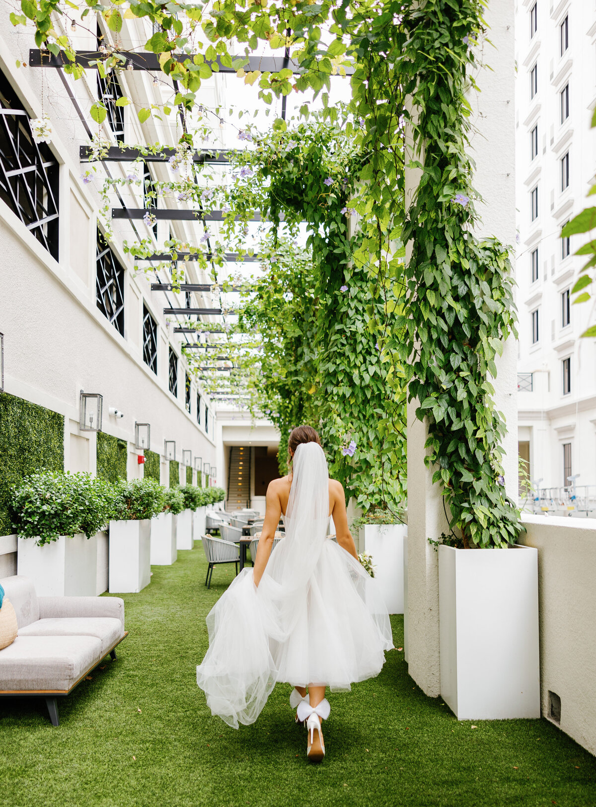 Bride walking at a Miami wedding venue captured by Claudia Amalia Photography, a wedding and lifestyle photographer based in Miami and Florida Keys South Florida. Destination weddings included.