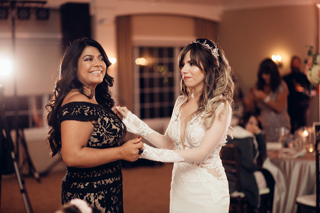 Wedding Photograph Of Bride Dancing With A Woman In Black Dress Los Angeles