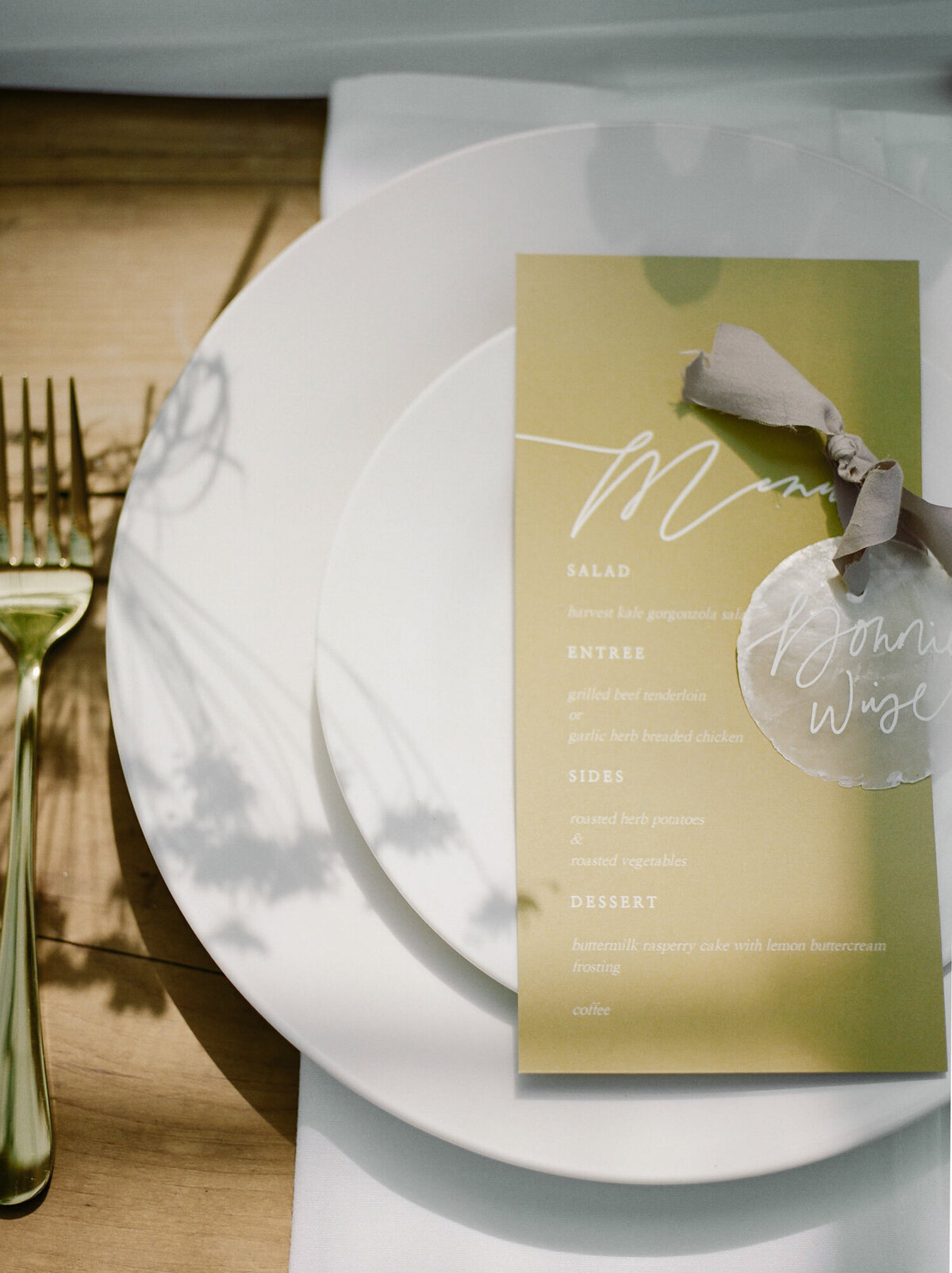 flower shadows and light on menu at Glass House Community wedding in Michigan