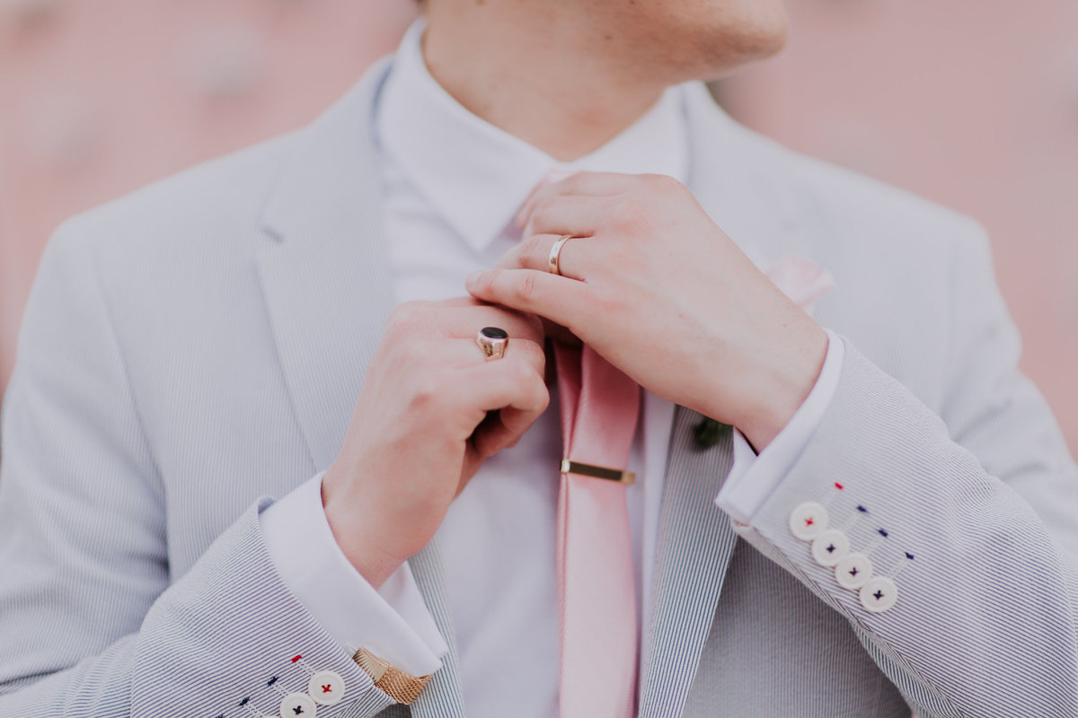 Lake Tahoe wedding photography groom adjusts his tie