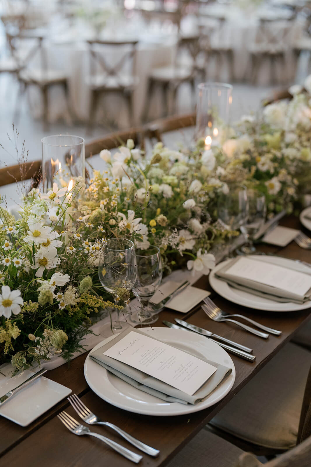Wedding reception table at Aspen Meadows Resort, featuring an elegant menu card and detailed place settings.
