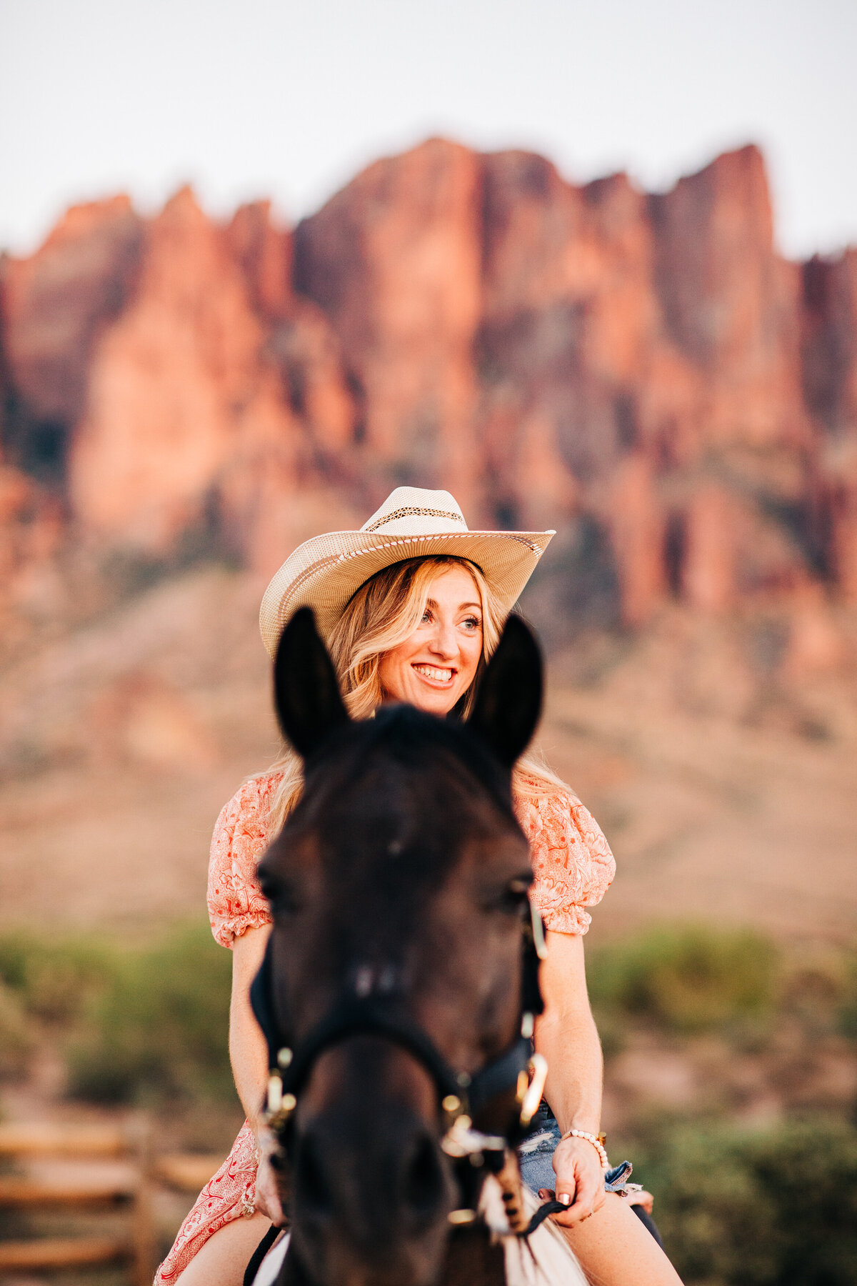 cowgirl looking between the ears of her horse