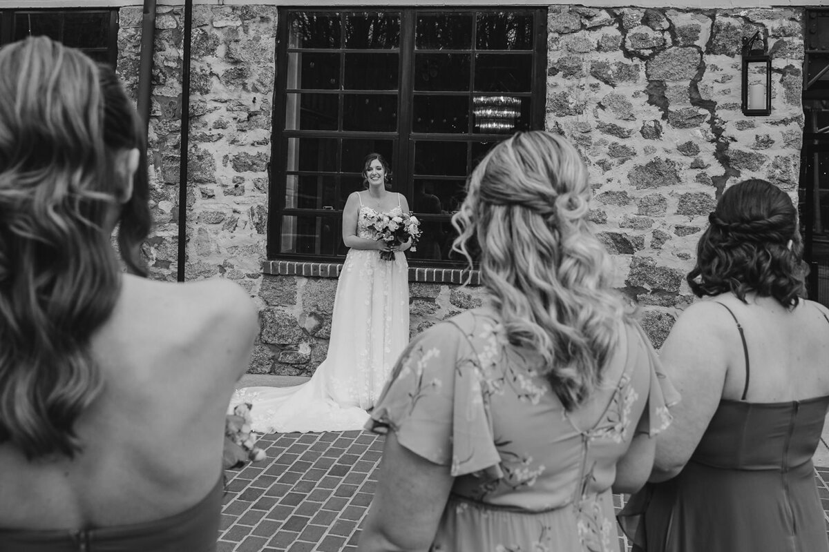 A person in a wedding dress walking into their wedding ceremony 