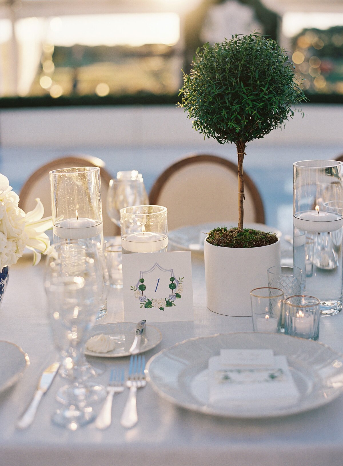 A close up of the place setting at the wedding reception. 