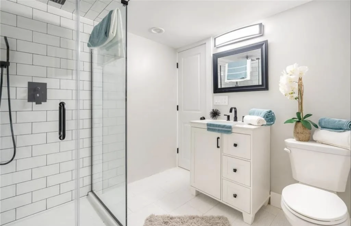 white bathroom with blue accents