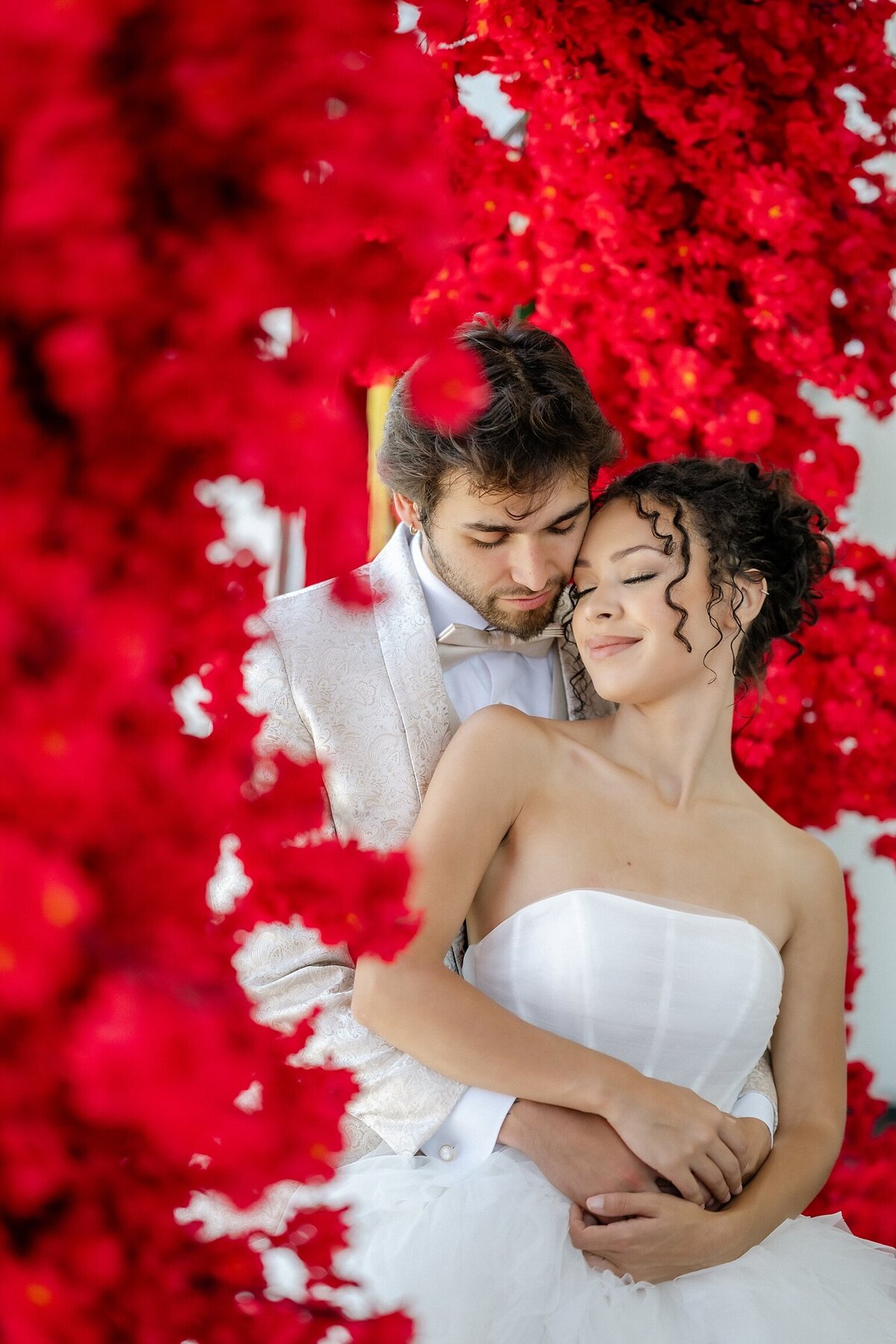 Bride and Groom with Red Flowers