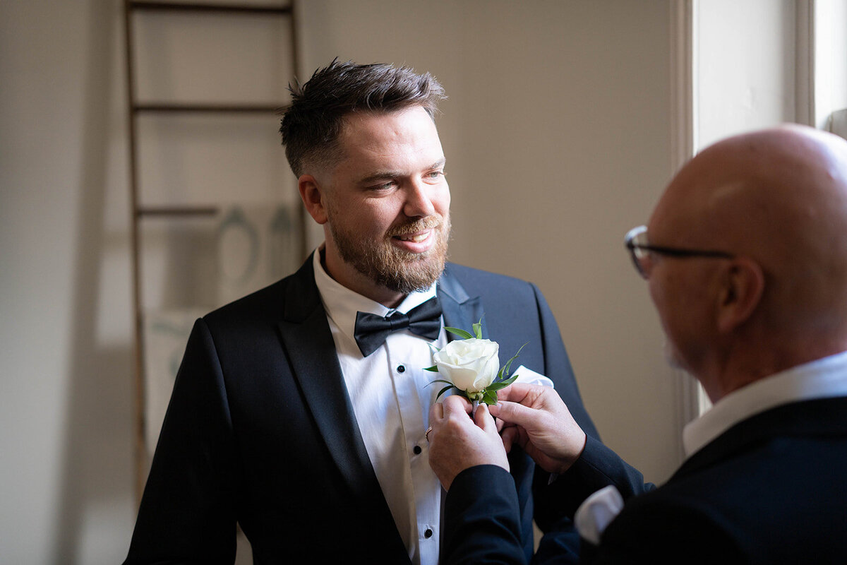 Groom getting reaady with his father