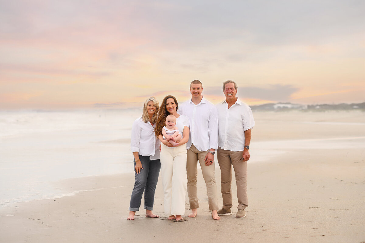 Family poses for Family Portraits during their Photoshoot on Isle of Palms beach in Charleston, SC.