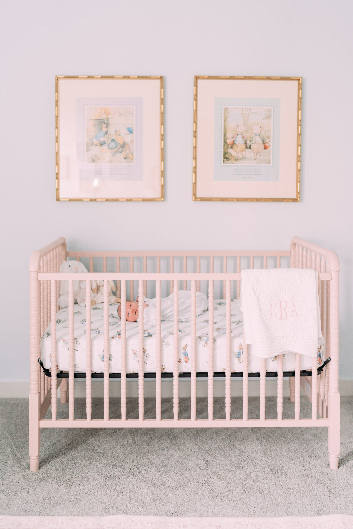 infant girl lies in crib