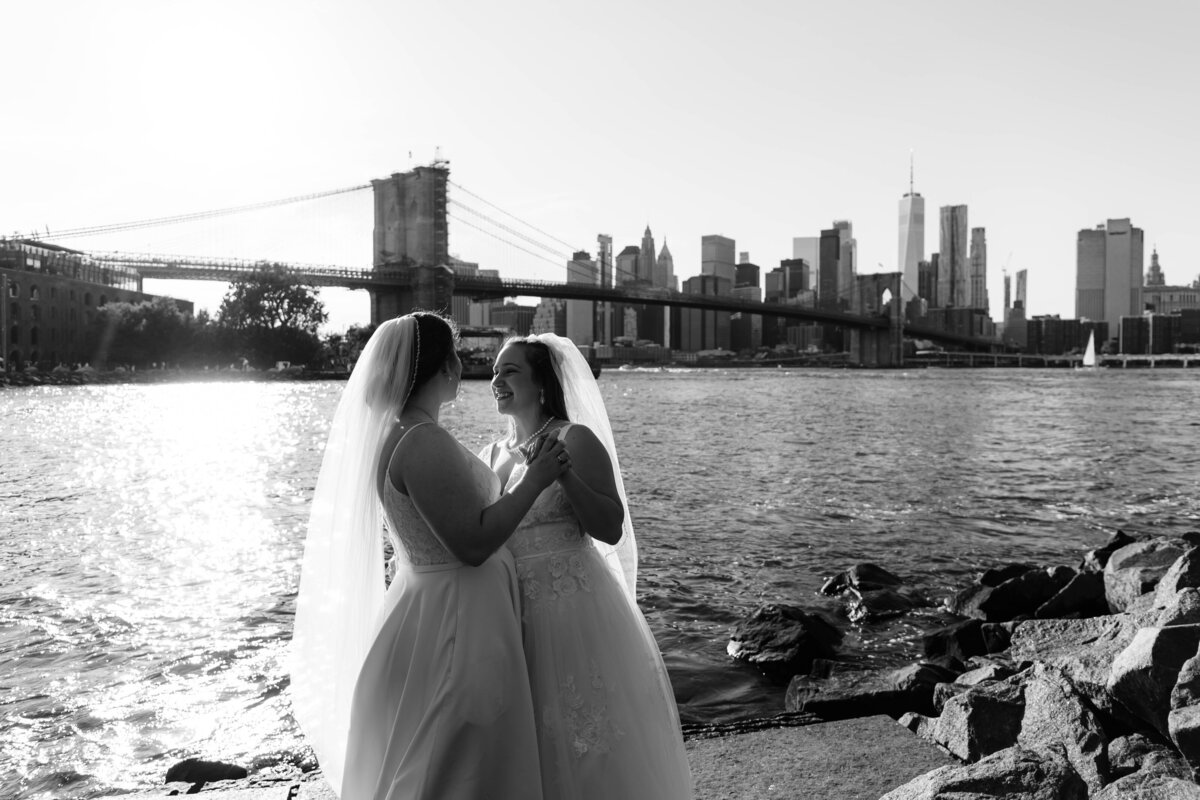 lesbian couple dance with new york skyline in background