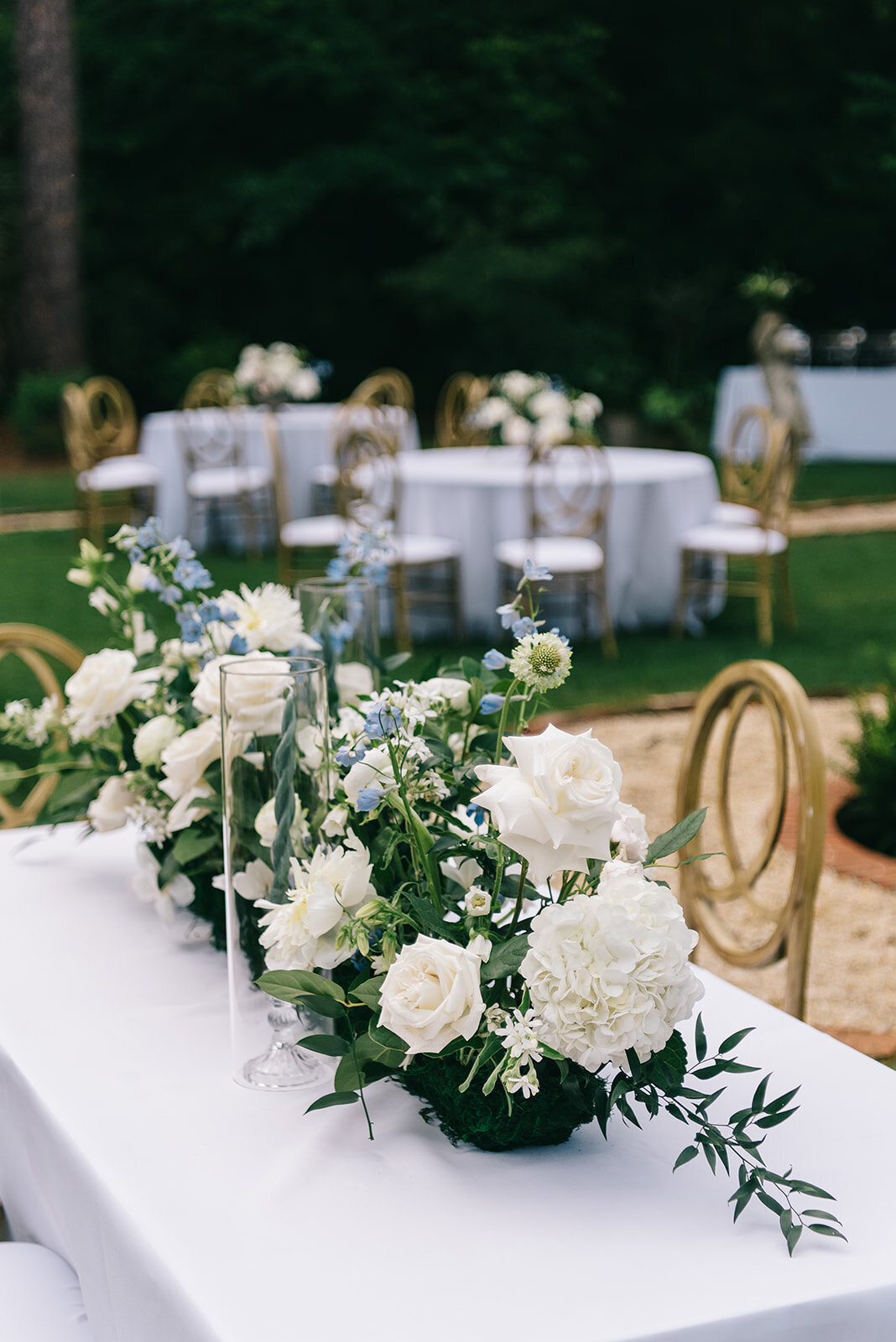 White and blue floral centerpieces designed by Abby Grace Florals at Greenville SC wedding