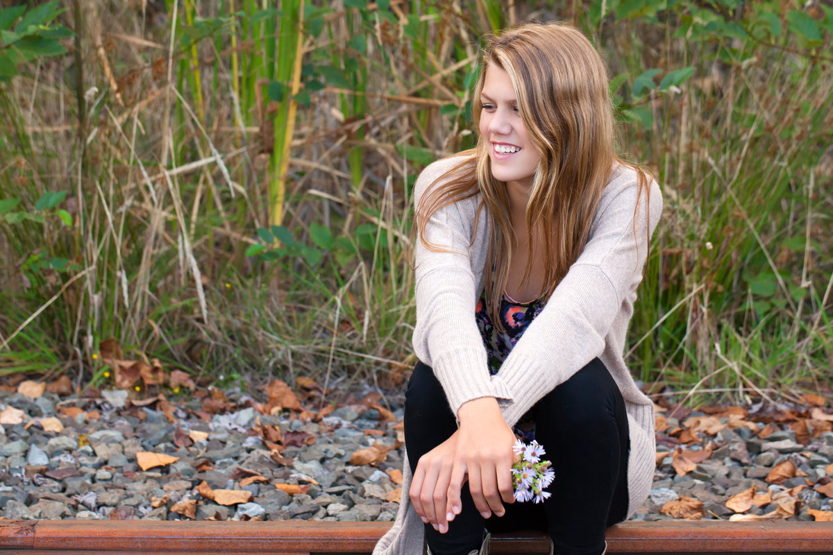 A few images of the only girl in a family of boys on dead railroad tracks