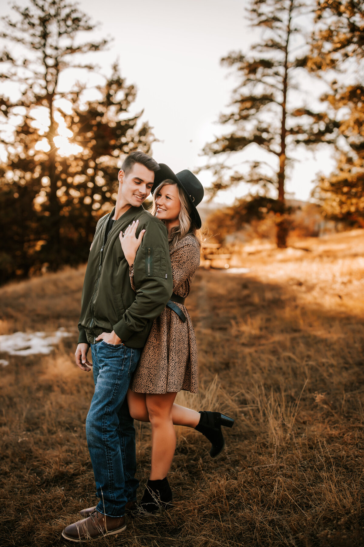 Colorado couple hold eachother in the middle of fall foliage for a couples session