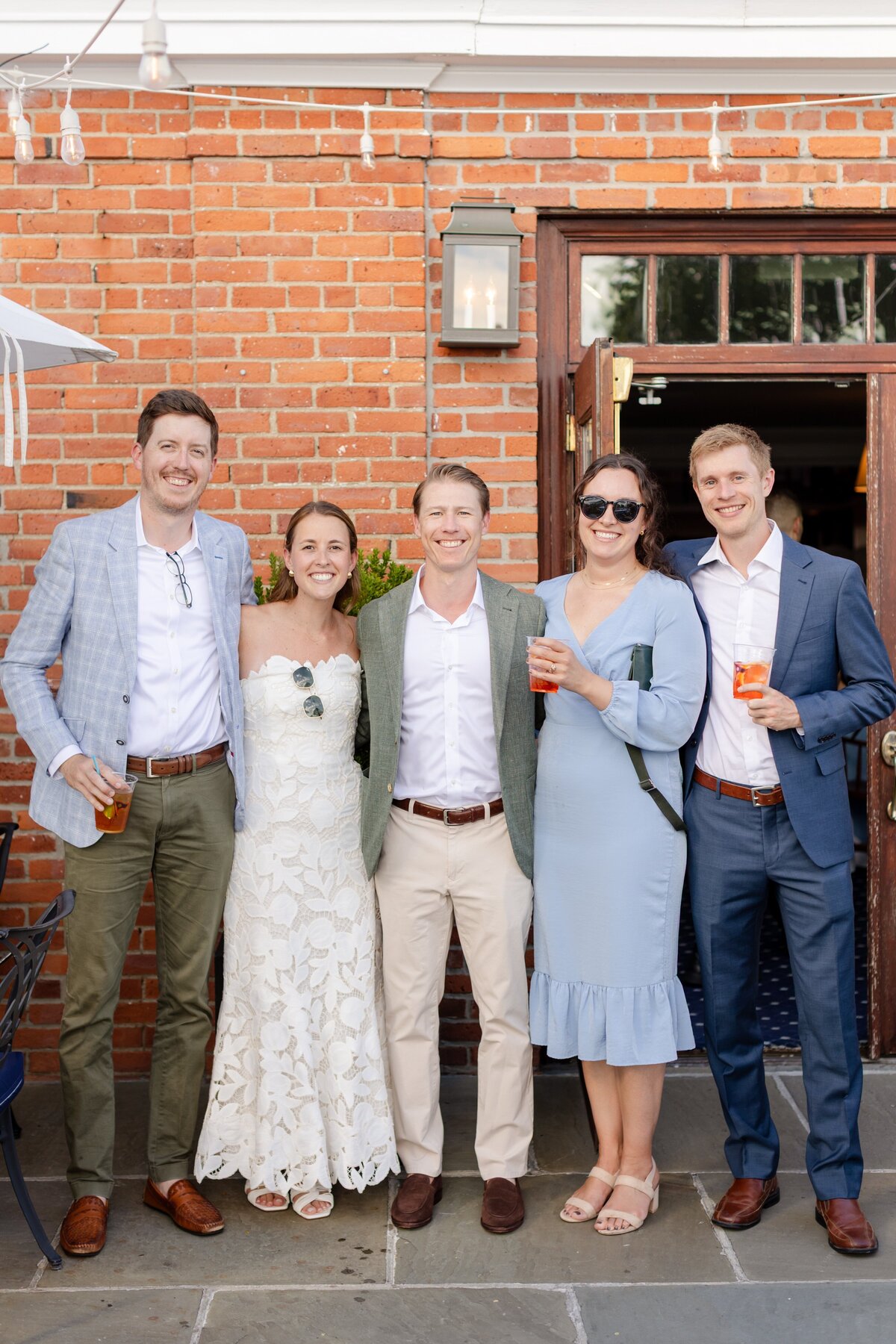 guests and couple smiling during welcome drinks on the lawn of American Yacht Club in Rye, NY 