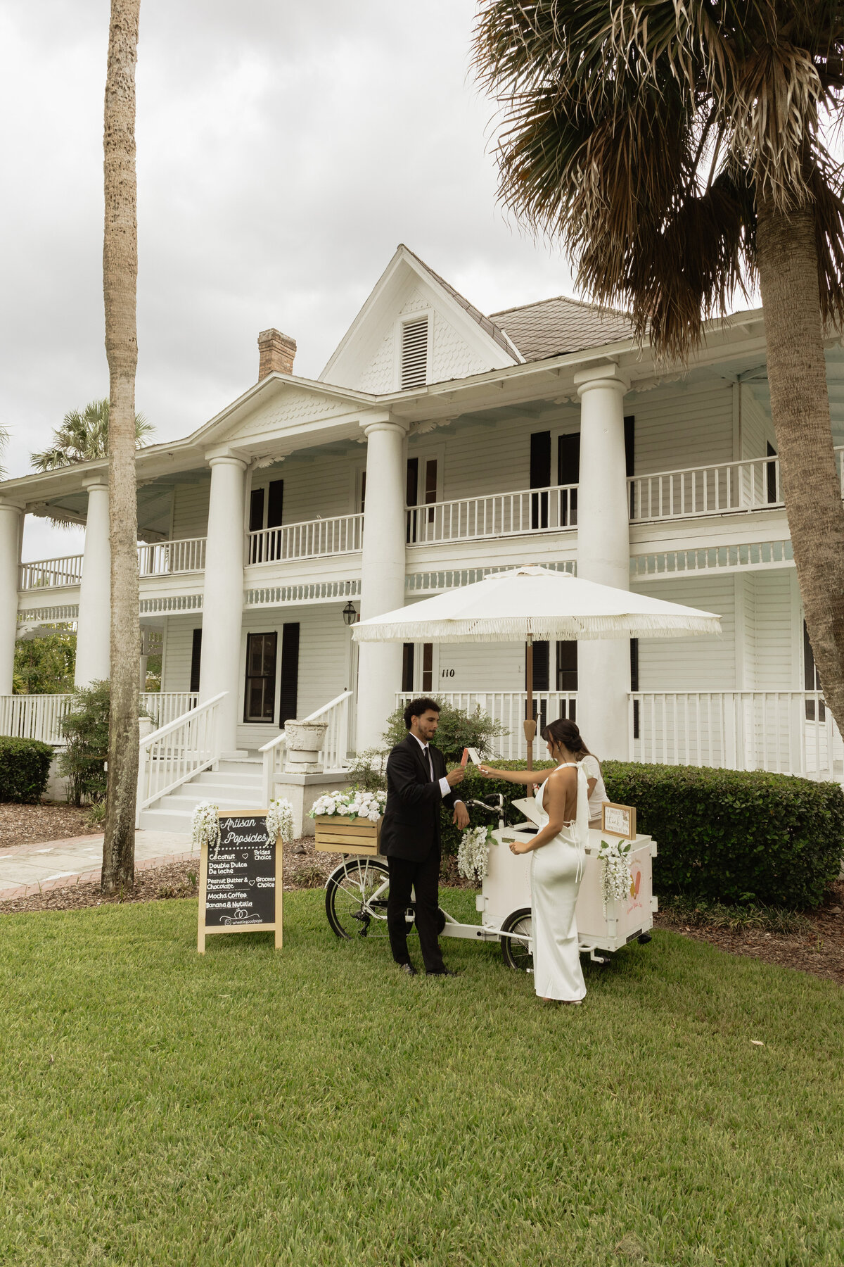 Charming pastel popsicle cart at a Florida wedding reception at The Palm Mansion