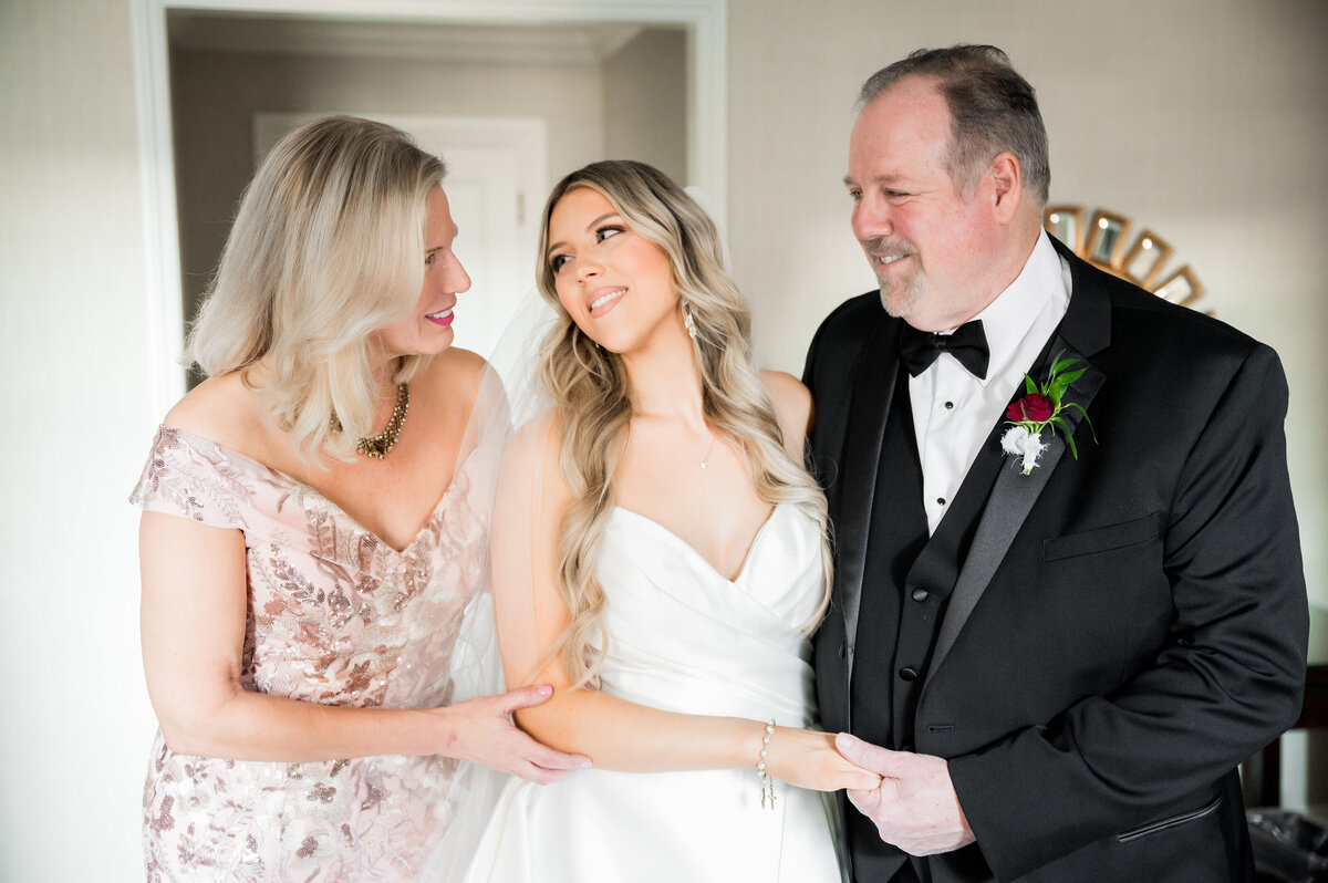 bride and her parents before leaving for wedding ceremony
