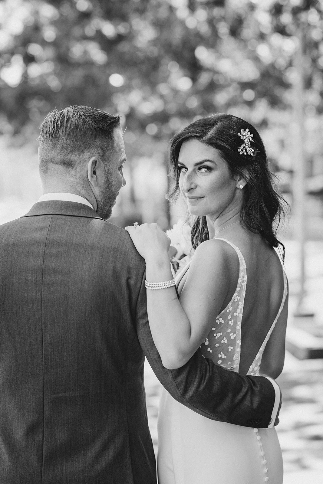 Utah Wedding Photography capturing bride looking back after Spring wedding