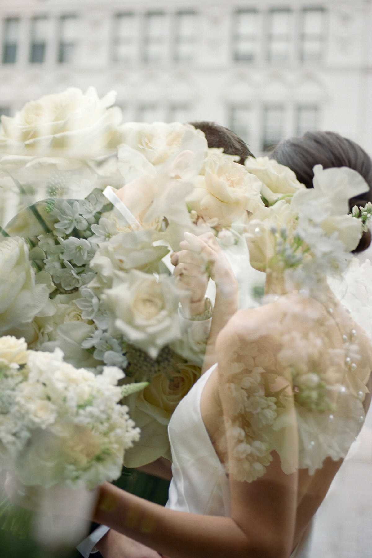 film double exposure wedding photo, flowers, couple kiss, Michigan film wedding photographer
