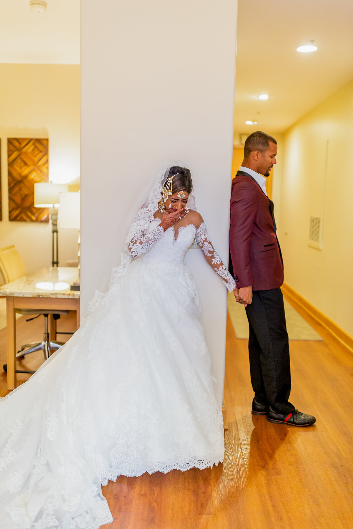 Bride and Groom Hold Hands Before Getting Married