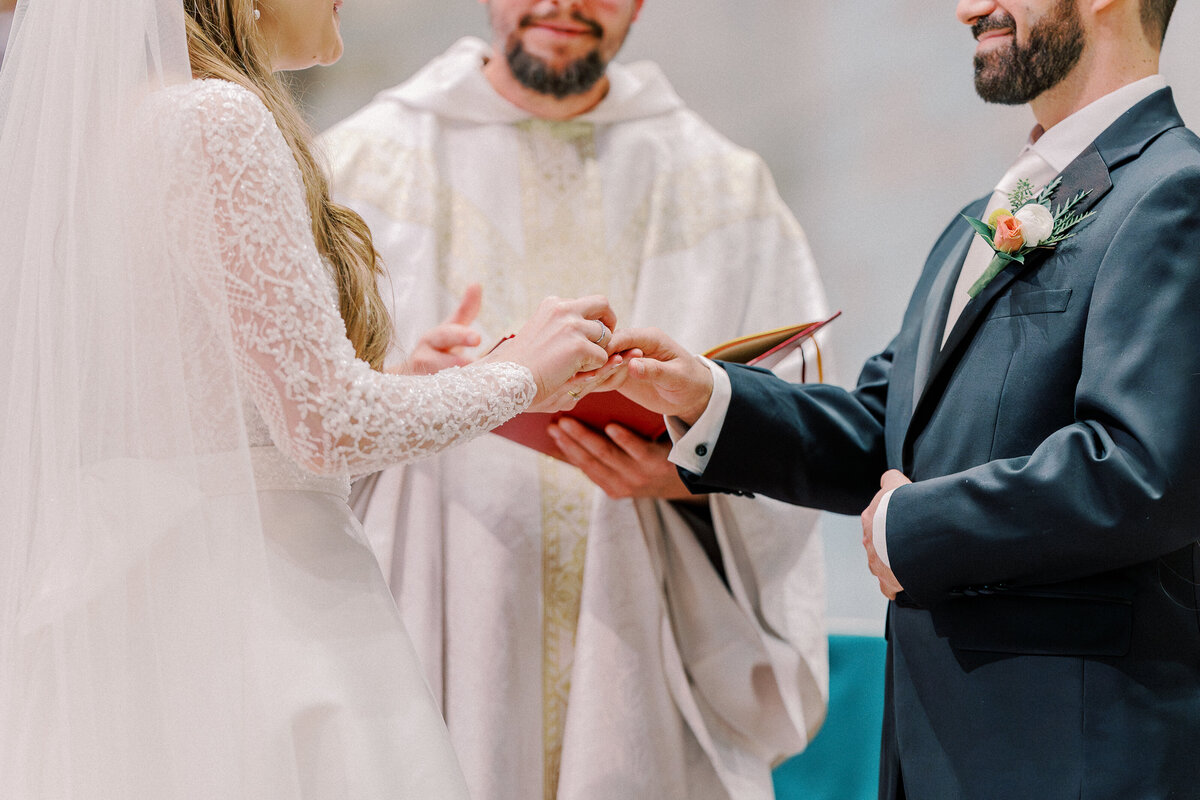 Ring exchange during Our Lady Sorrows Church wedding