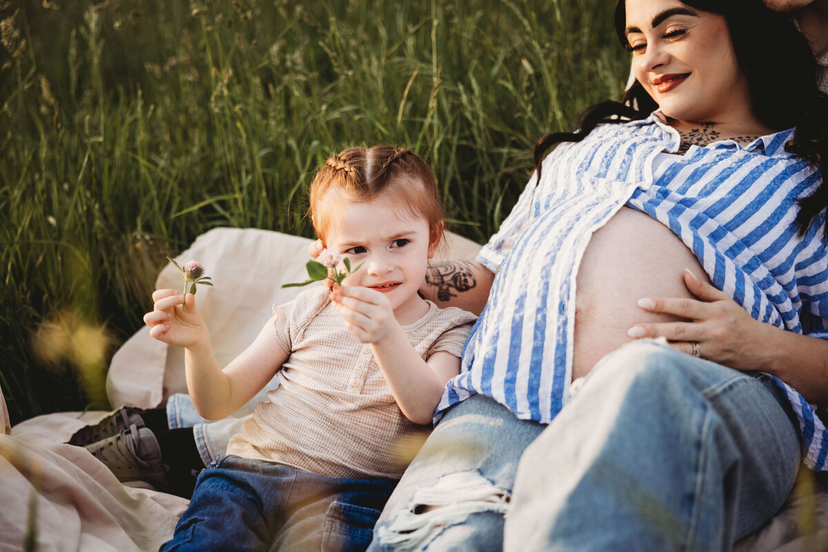 mom and daughter snuggling in portrait session with reva davis photography