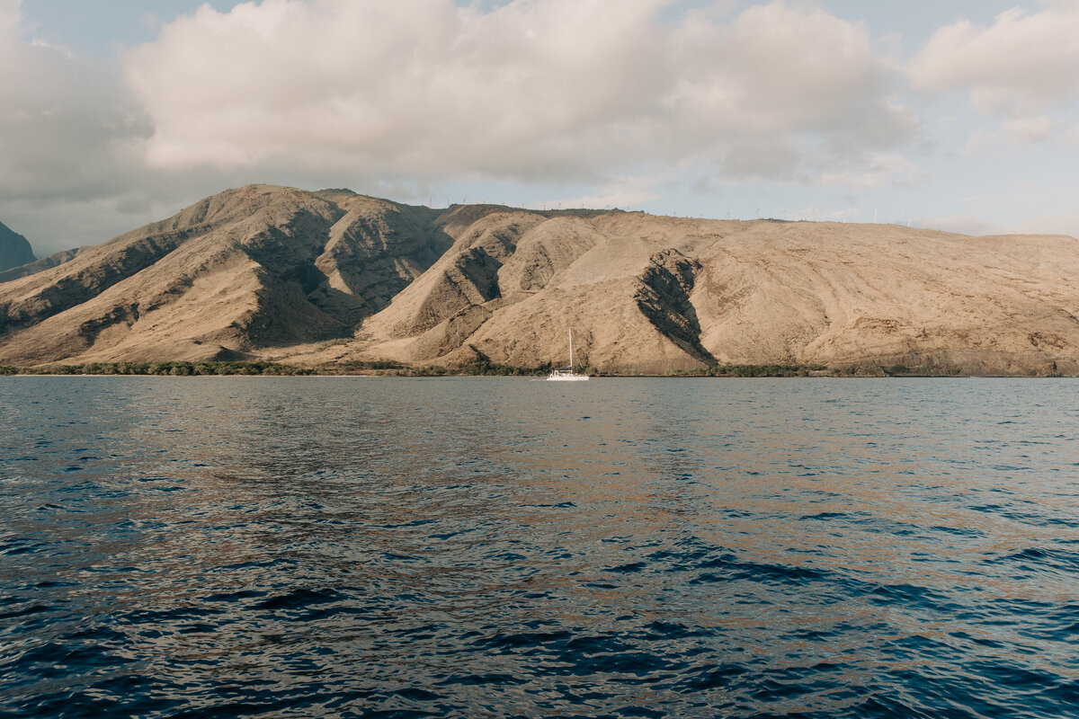 Maui Wedding Photographer captures boat on ocean after Maui beach wedding