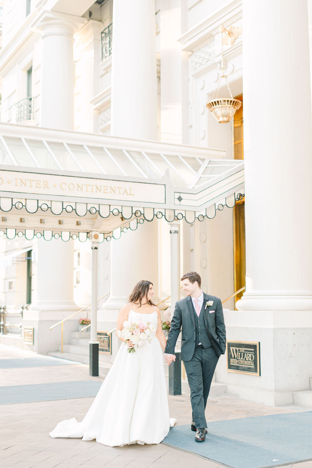 Couple walking outside The Willard InterContinental