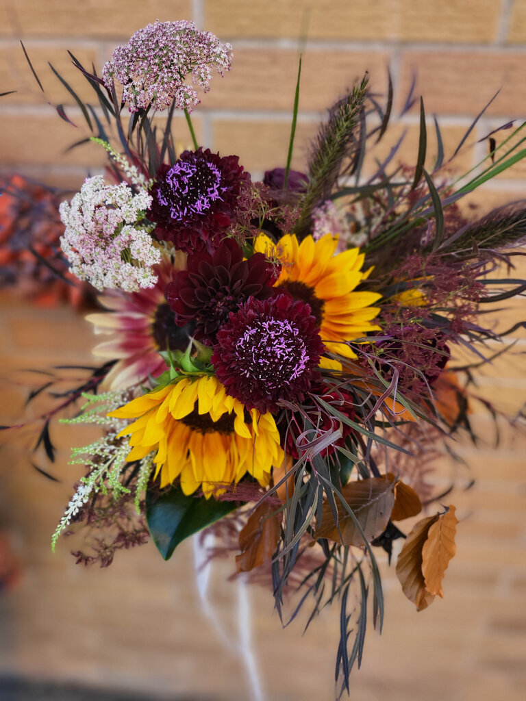 Spring inspired yellow and purple bridal bouquet by Bloomdigity Floral Studio, an contemporary, Lethbridge, Alberta wedding florist, featured on the Brontë Bride Vendor Guide.