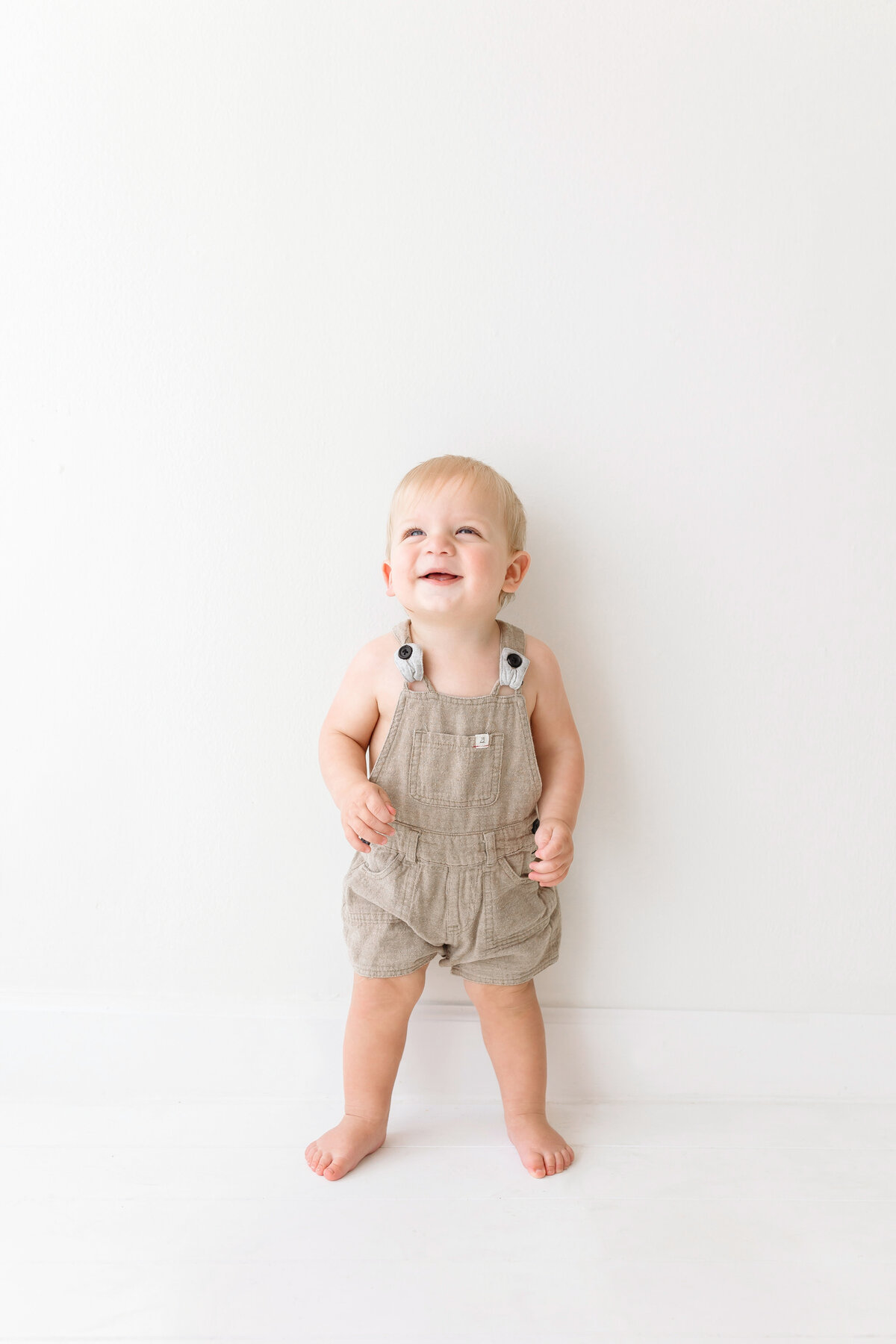 toddler smiling up