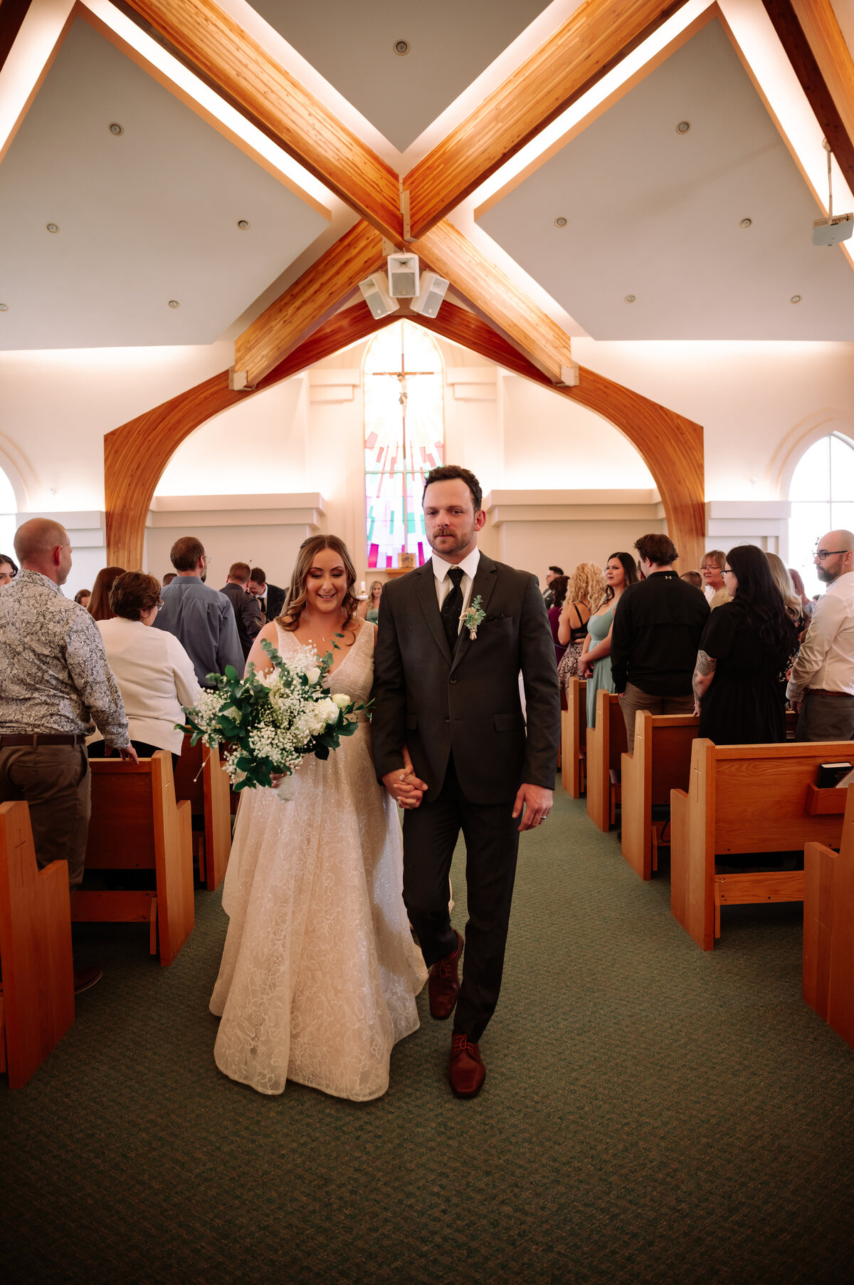 bride and groom walking down the aisle