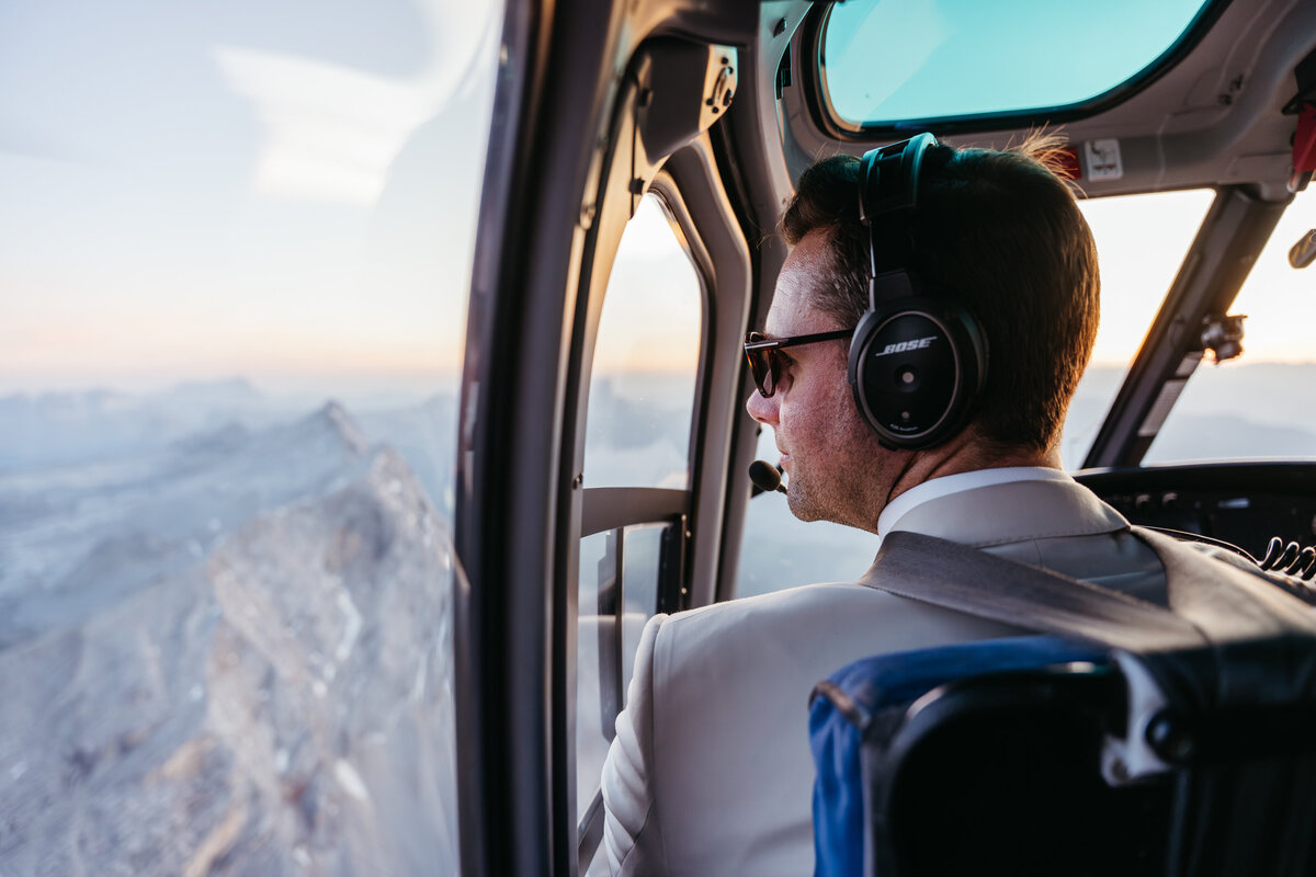 Helicopter flying over Dolomites peaks