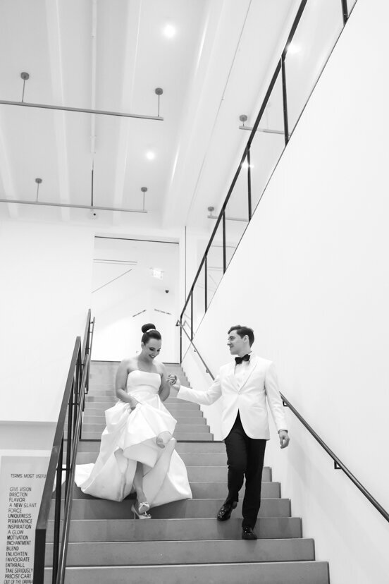 museum-of-contemporary-arts-san-diego-bride-and-groom-walking-down-stairs